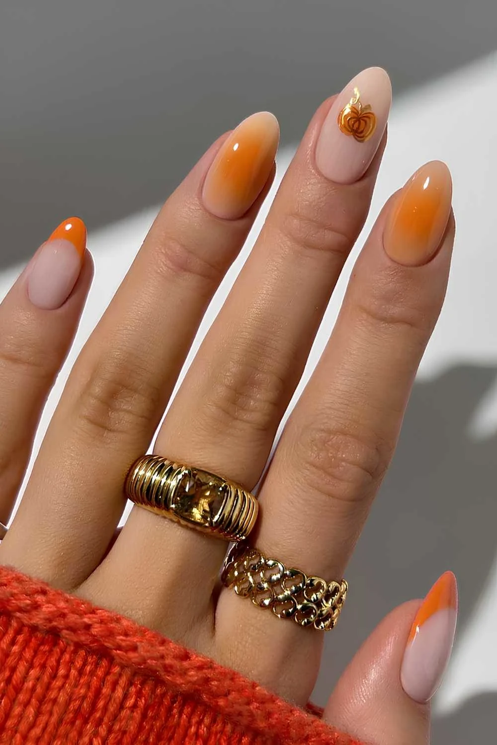 Orange nails with aura and pumpkin art