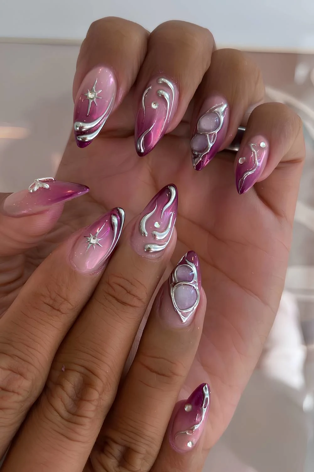 Purple ombre nails with silver chrome accents