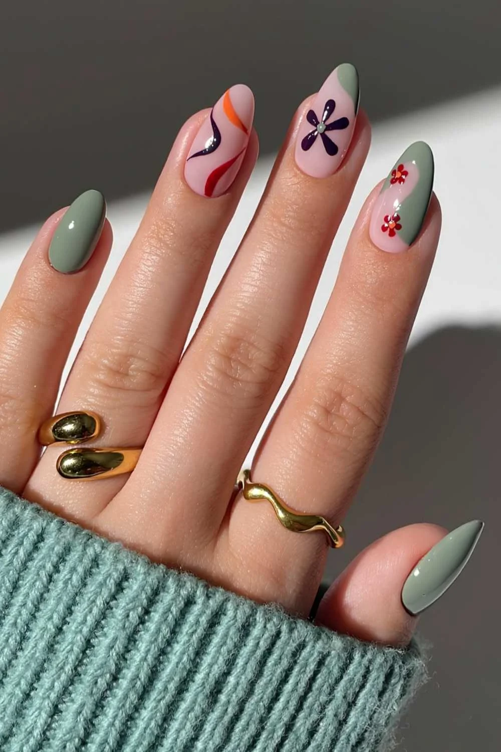 Sage green nails with floral and abstract art