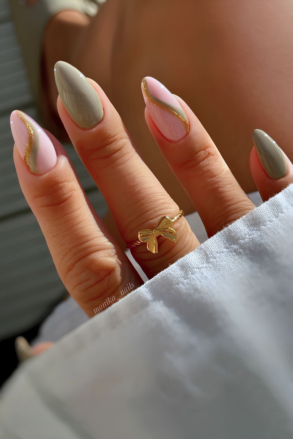 Sage green nails with gold glitter swirls