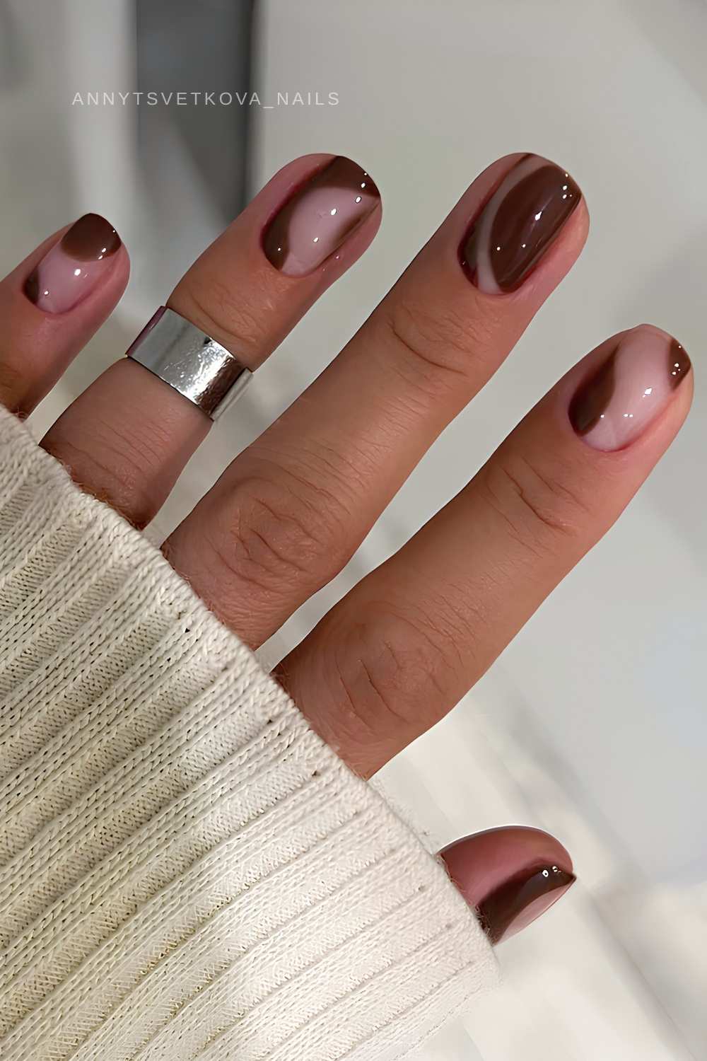 Short brown nails with negative space design