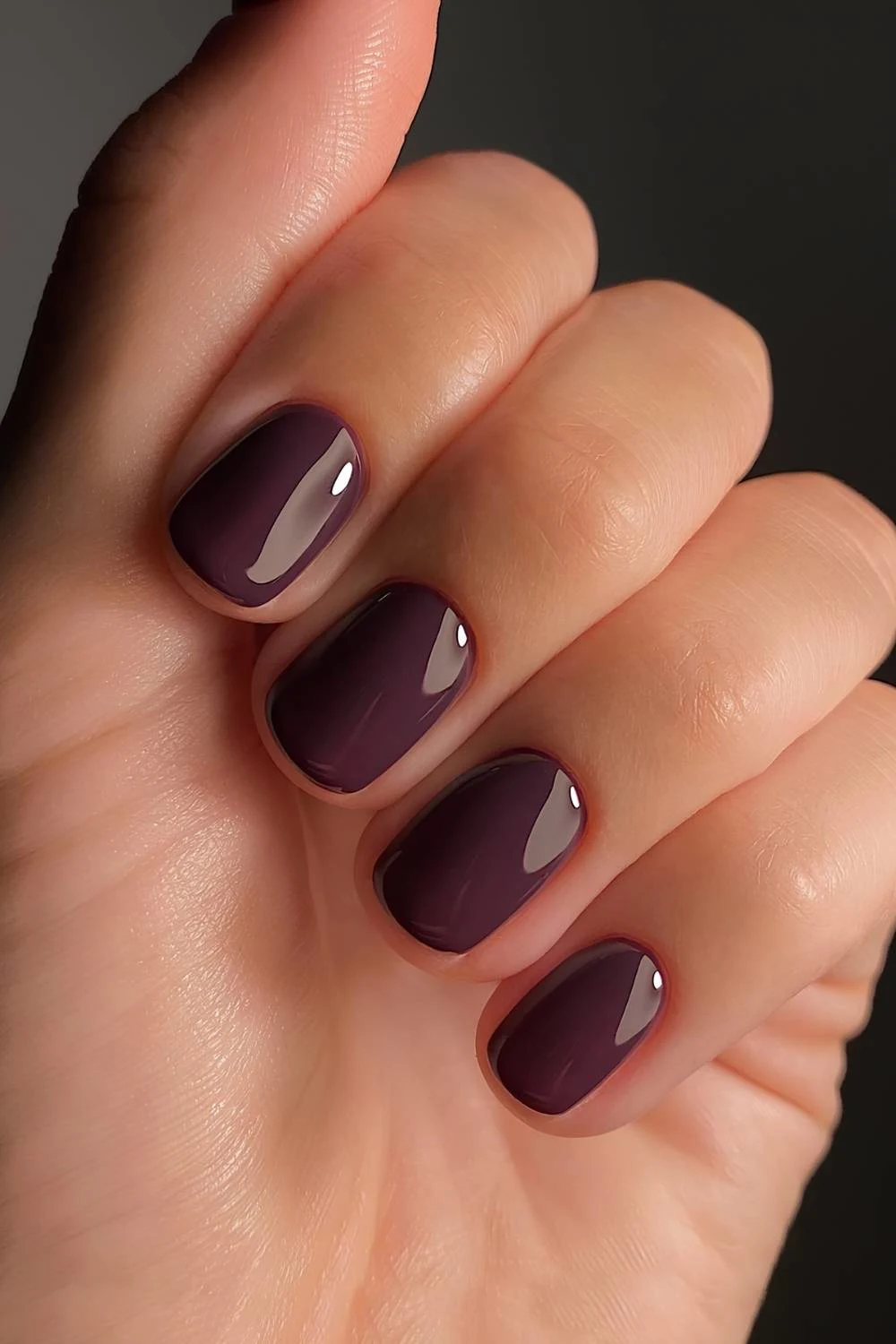 Short dark purple nails