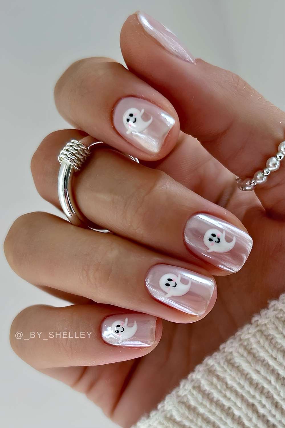 Short milky chrome nails with Halloween art