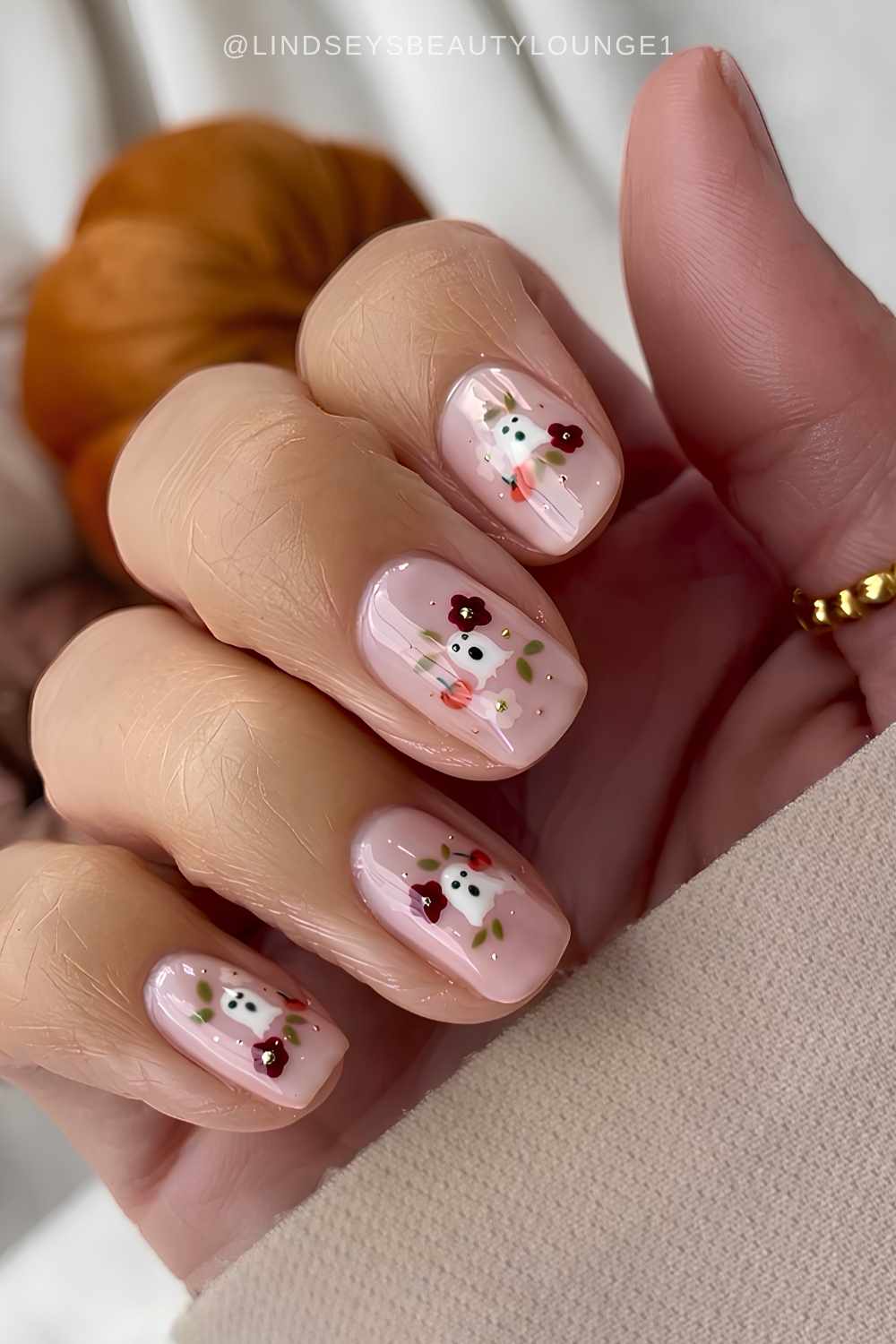Short milky nails with Halloween art