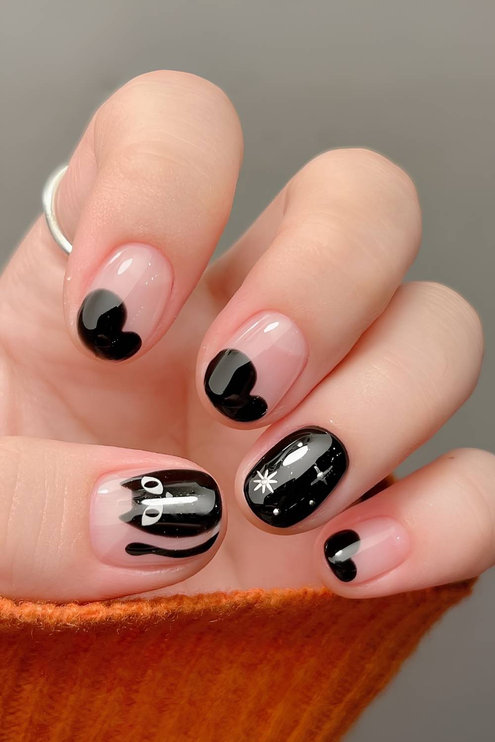 Short nails with black cat art for Halloween