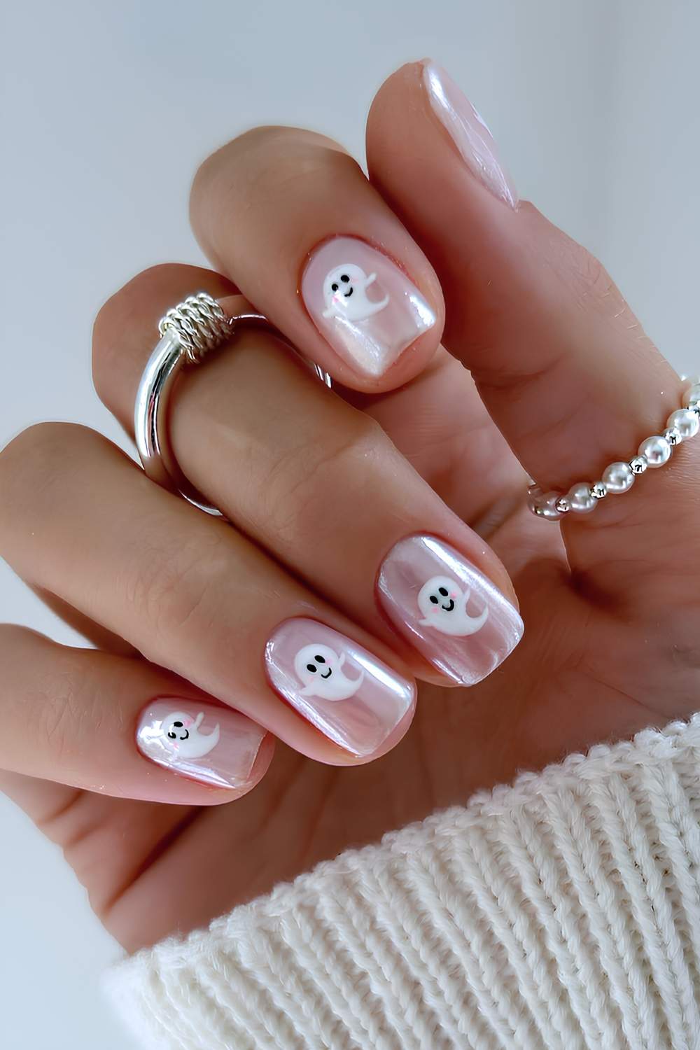 Short white chrome nails with Halloween art