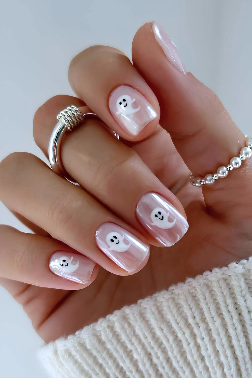 Short white chrome nails with Halloween art