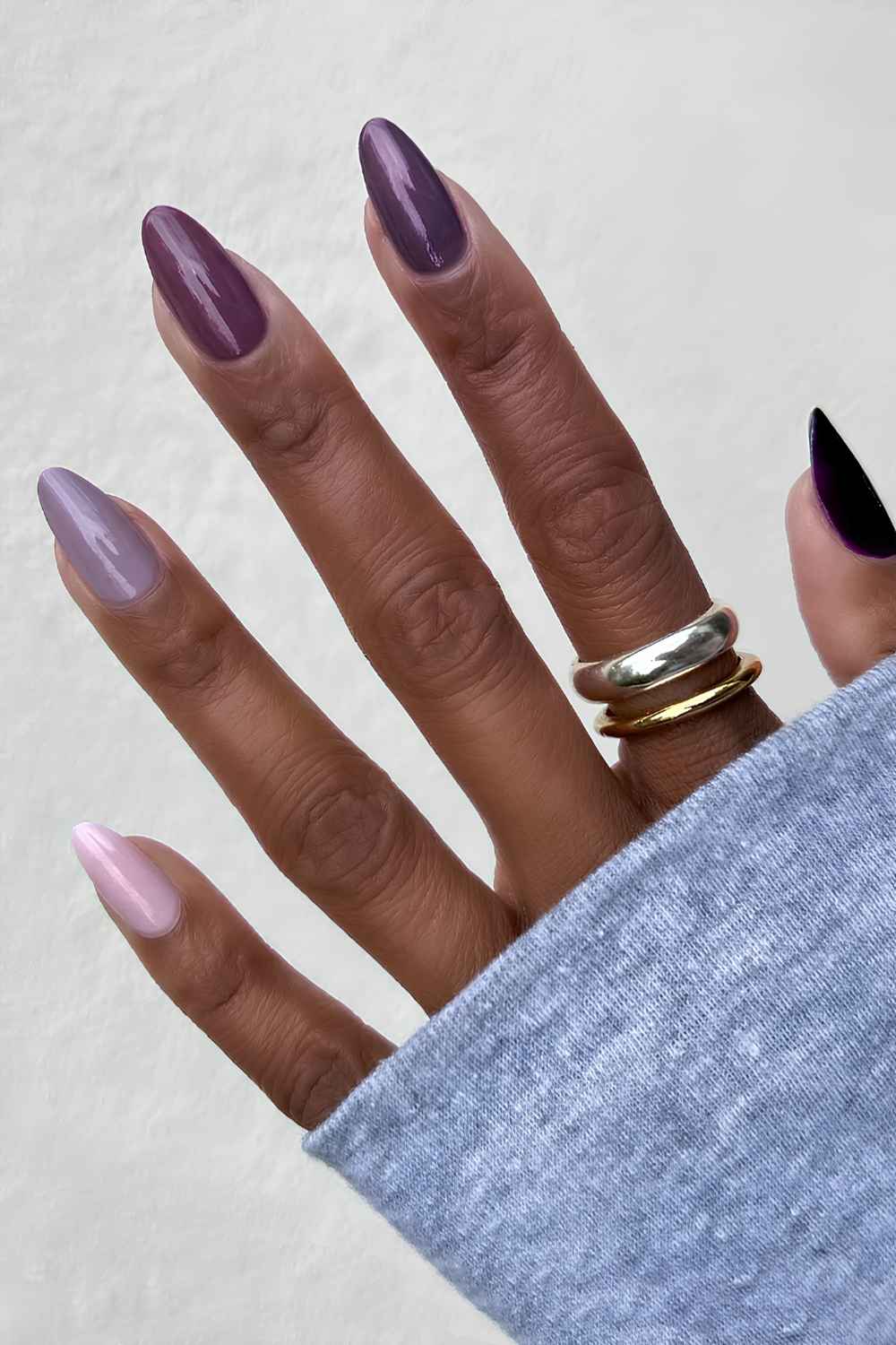 Skittle nails in different purple shades