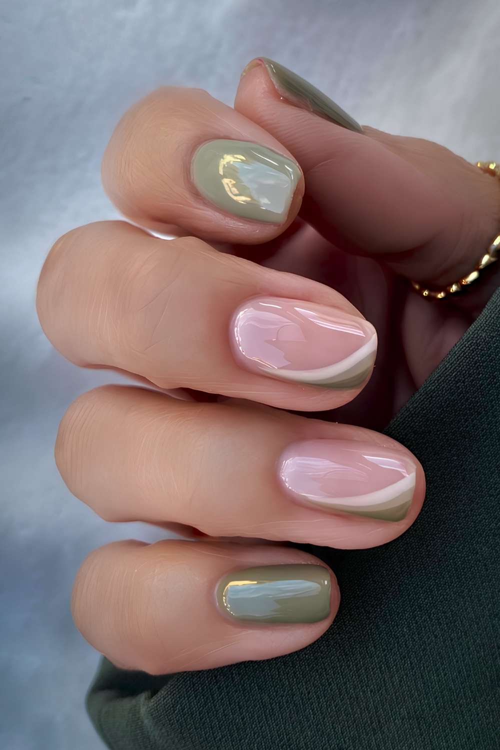 Soft green nails with accent line art