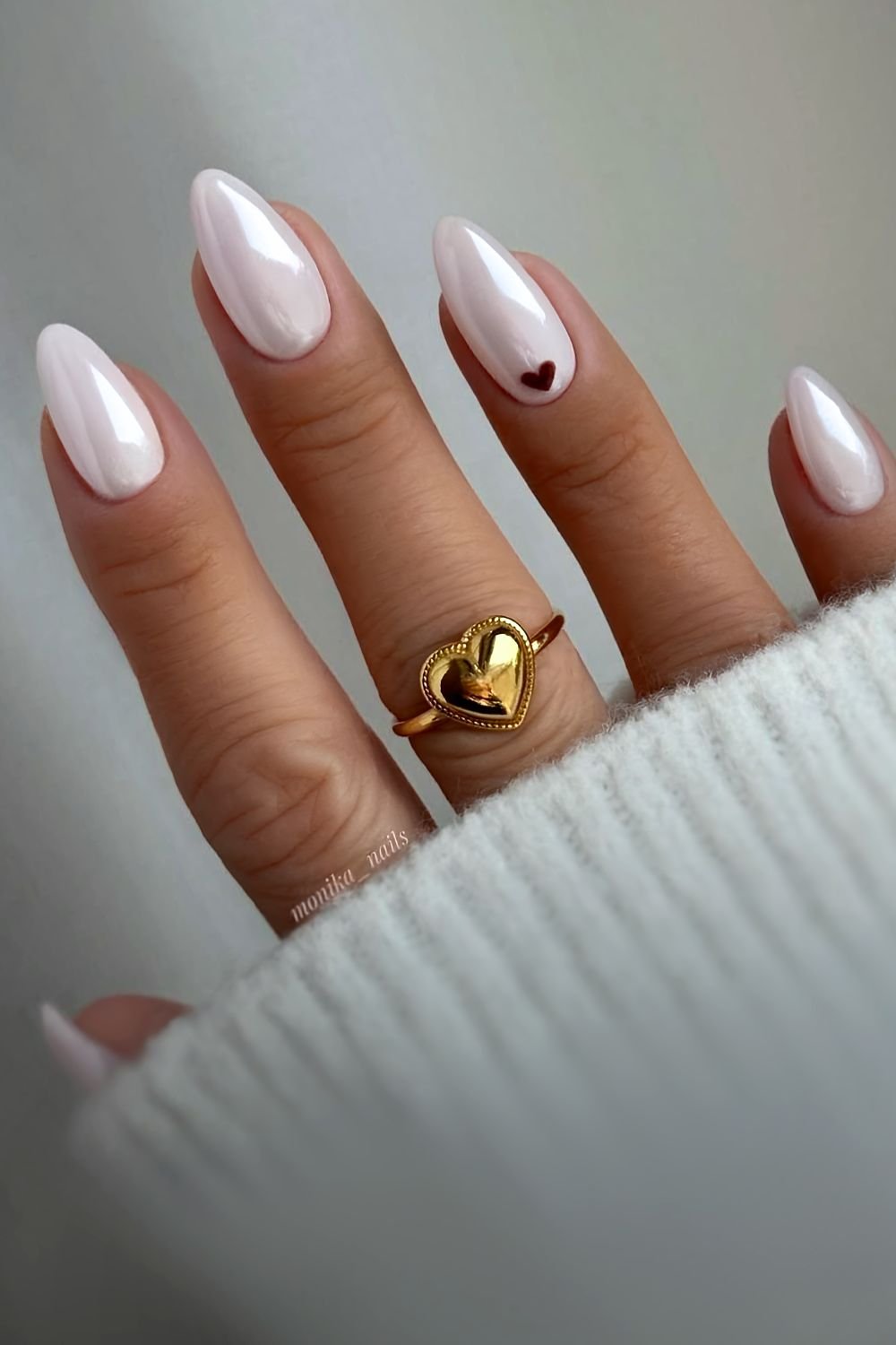 White chrome nails with brown heart accent