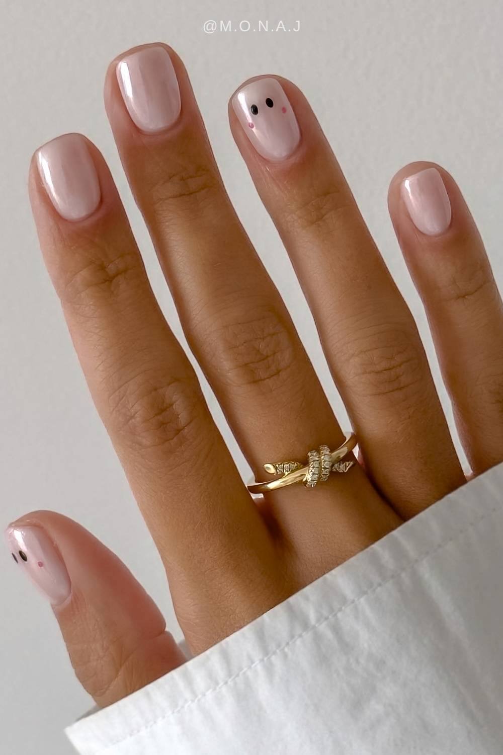 White chrome nails with minimalist Halloween art