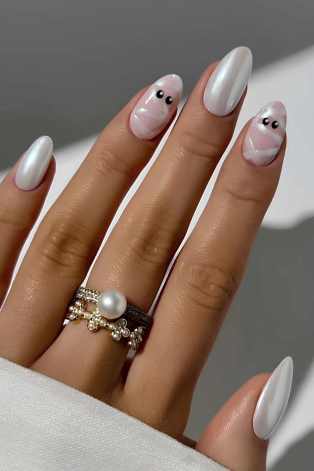 White chrome nails with mummy art