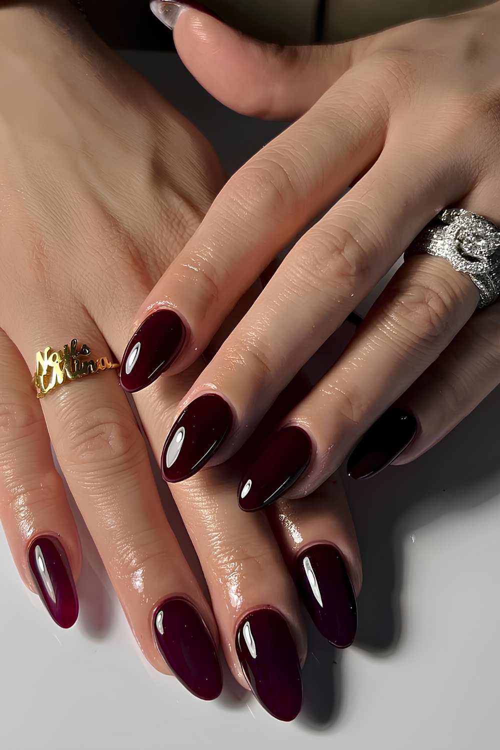 Almond black cherry nails