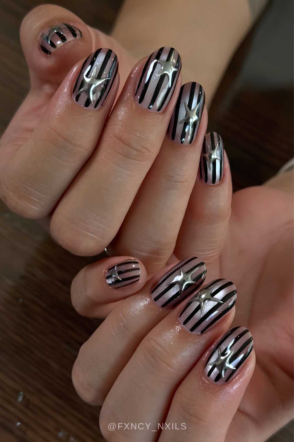 Black and gray striped nails with stars