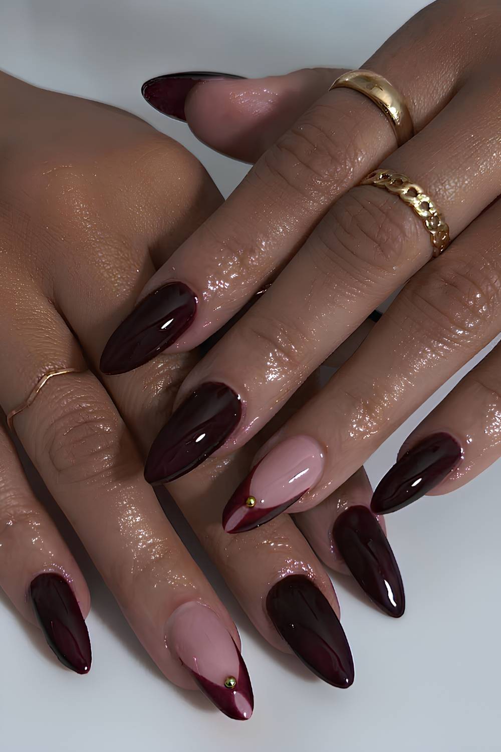 Blackened red mani with gold beads
