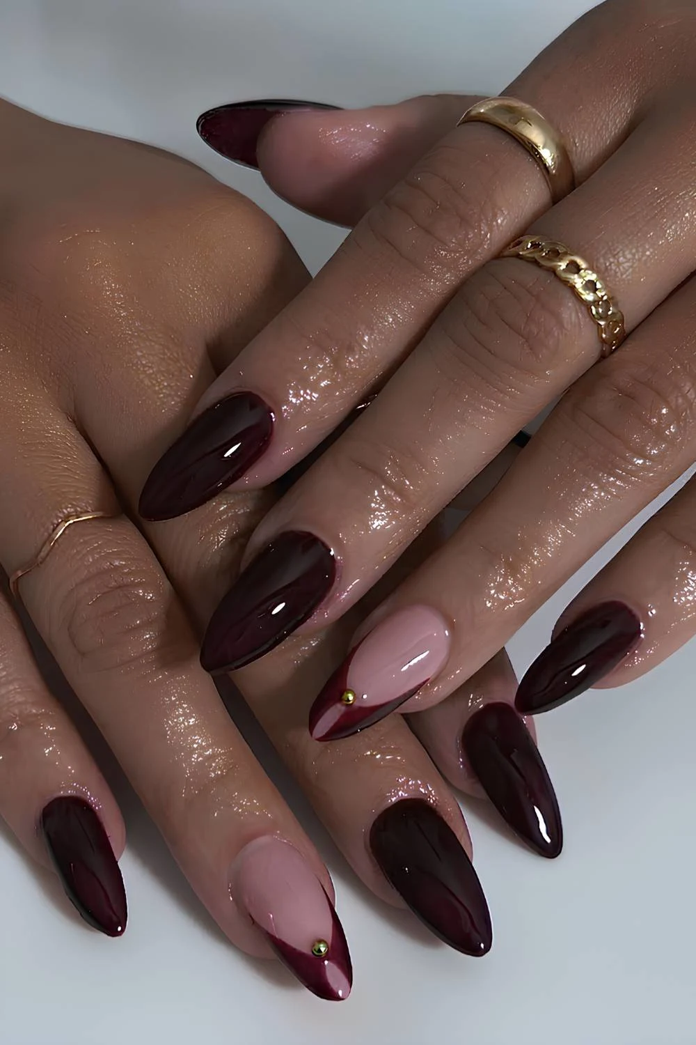 Blackened red mani with gold beads