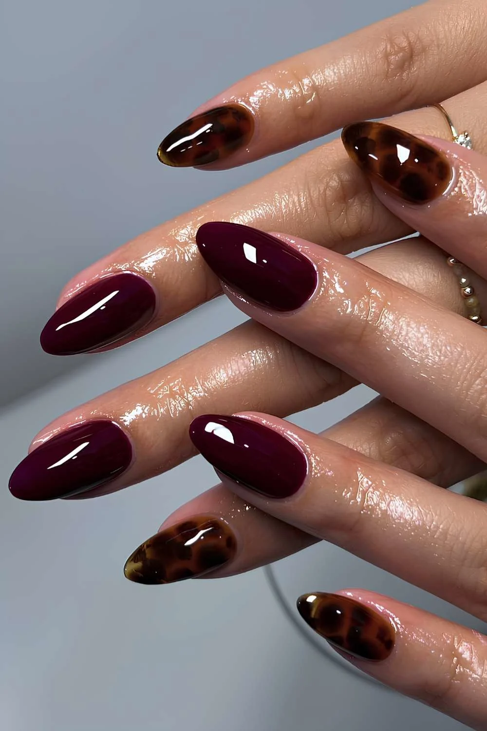 Dark red nails with tortie shell accents