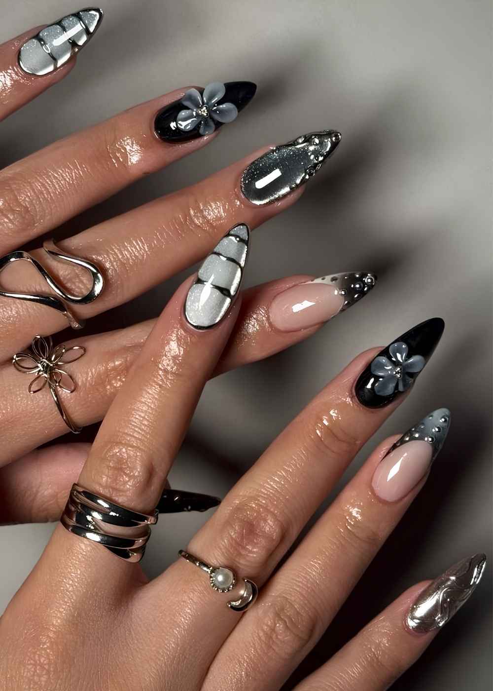 Textured black and silver mani with florals