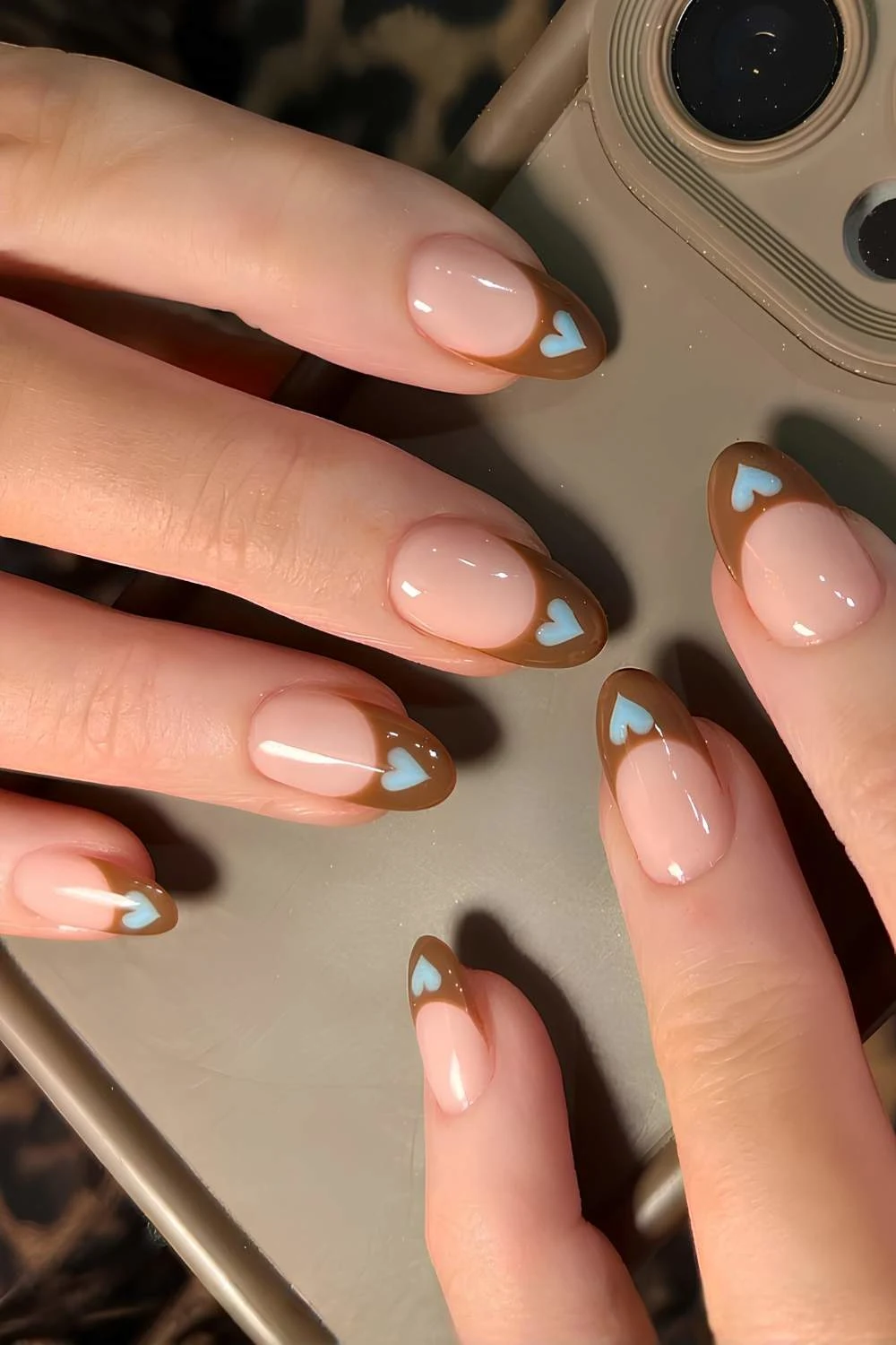 Brown French mani with blue hearts