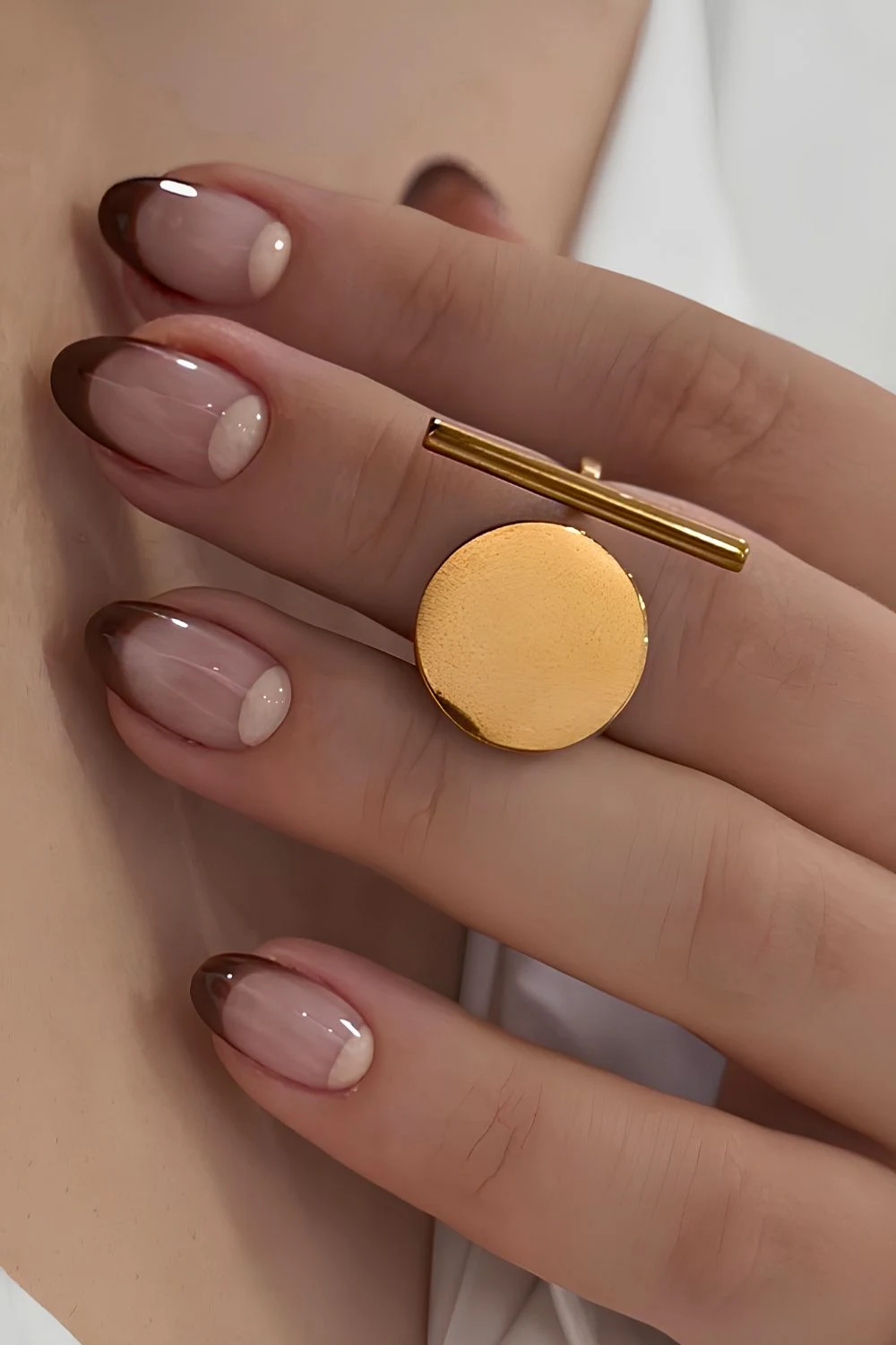 Brown French nails with half-moon art