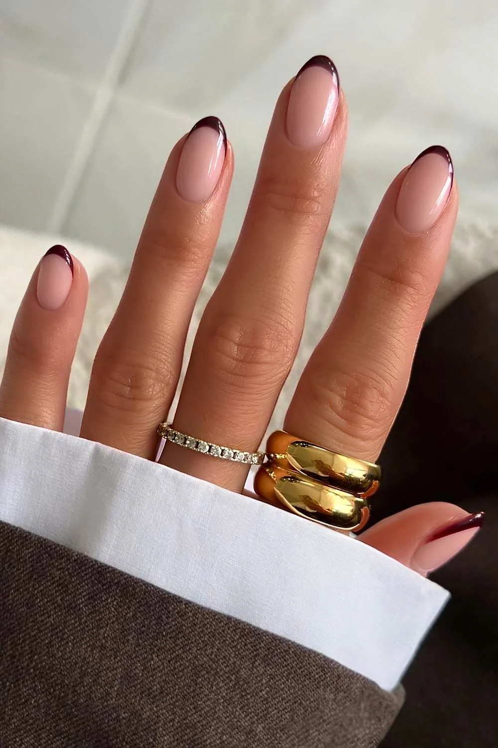 Brown oval French tip nails