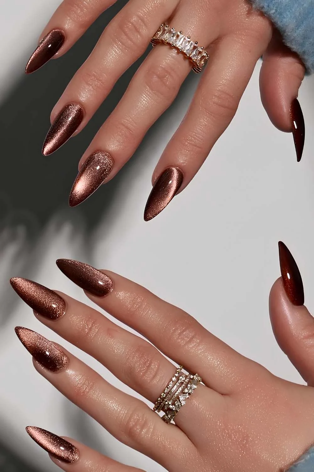 Long brown cat eye manicure