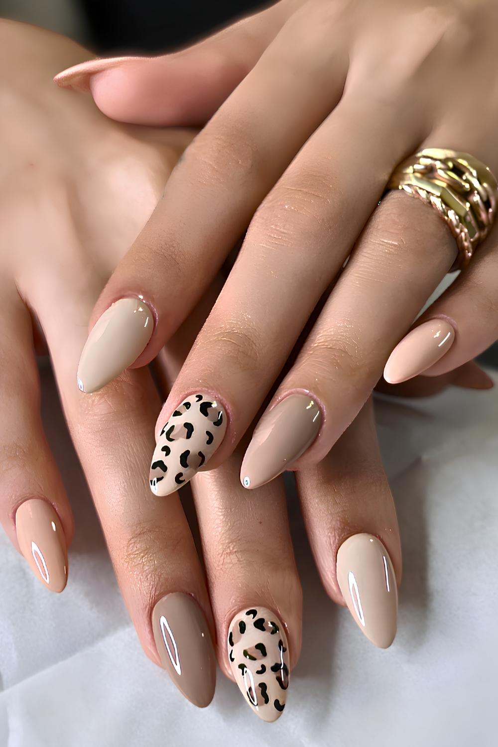 Neutral nails with brown and black leopard print