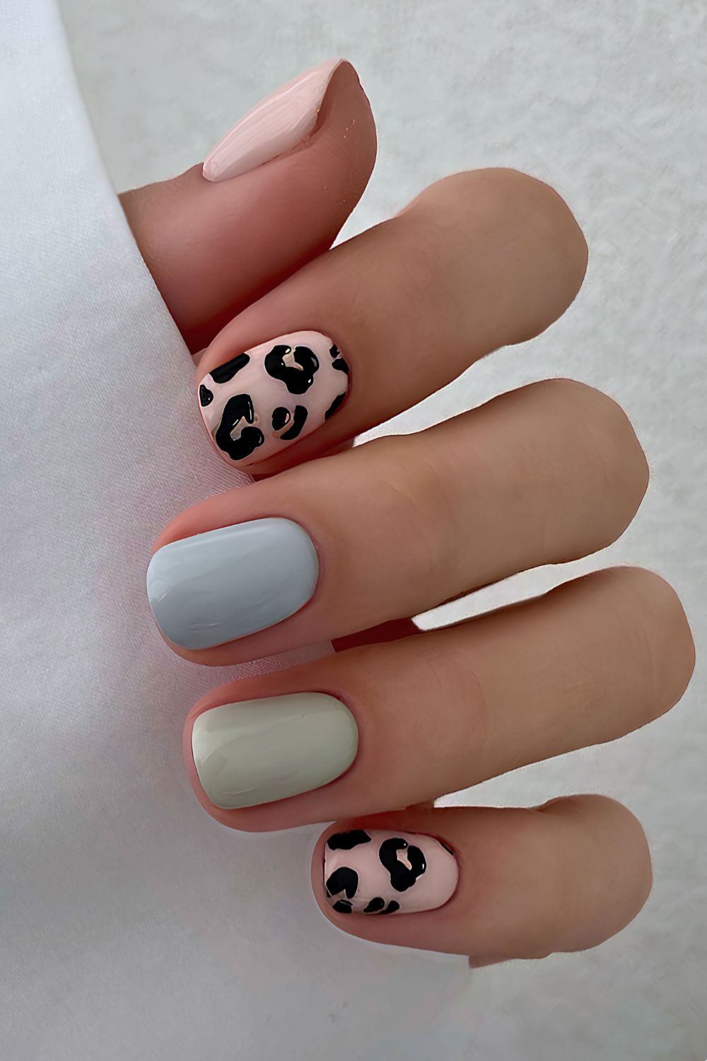 Pastel nails with leopard print accents