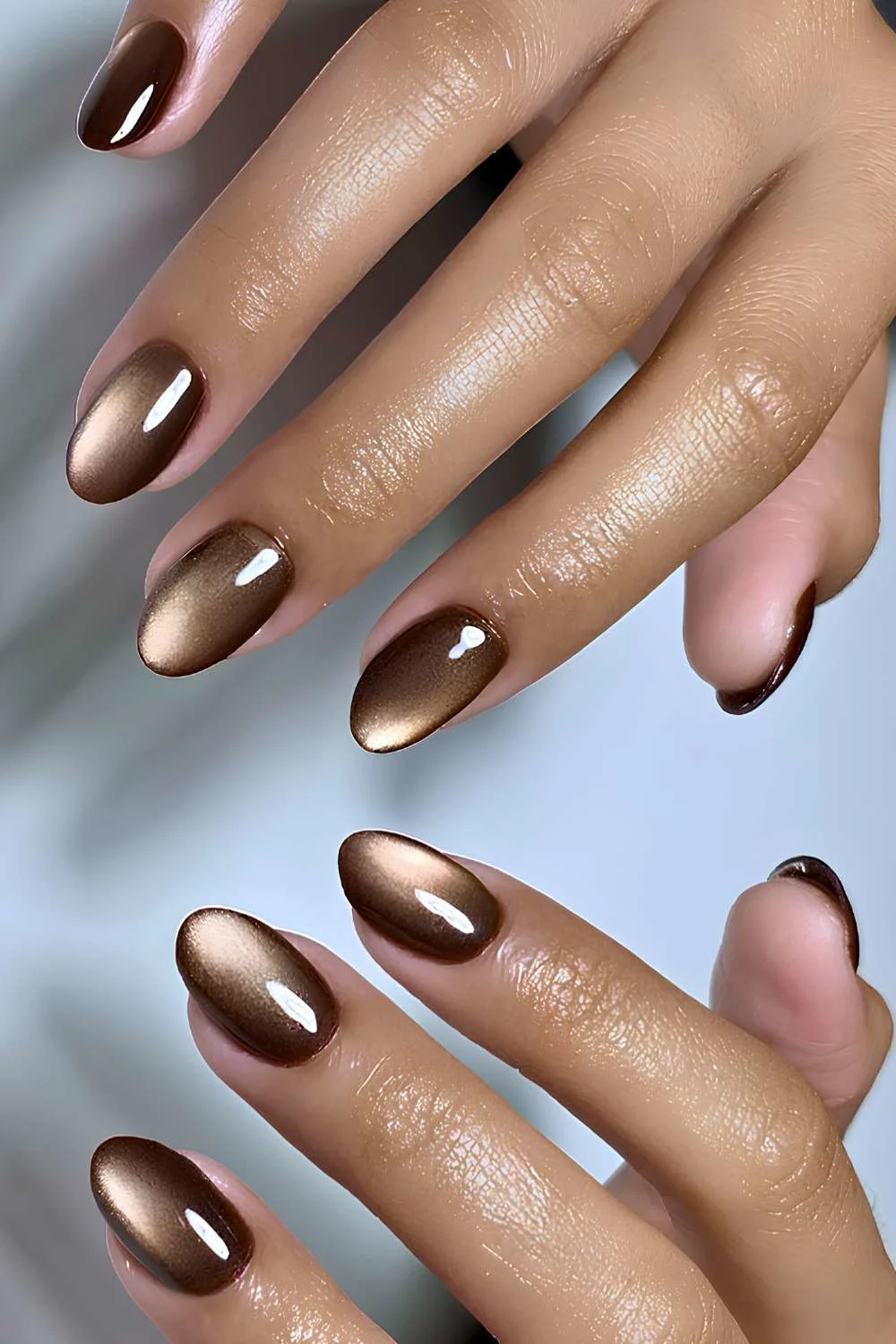 Round brown cat eye nails