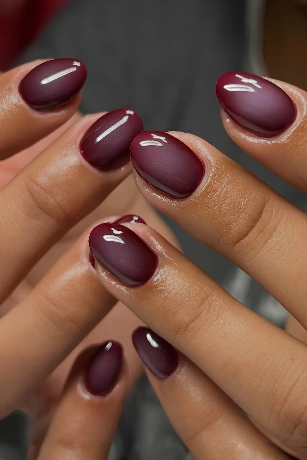 Short deep red aura nails