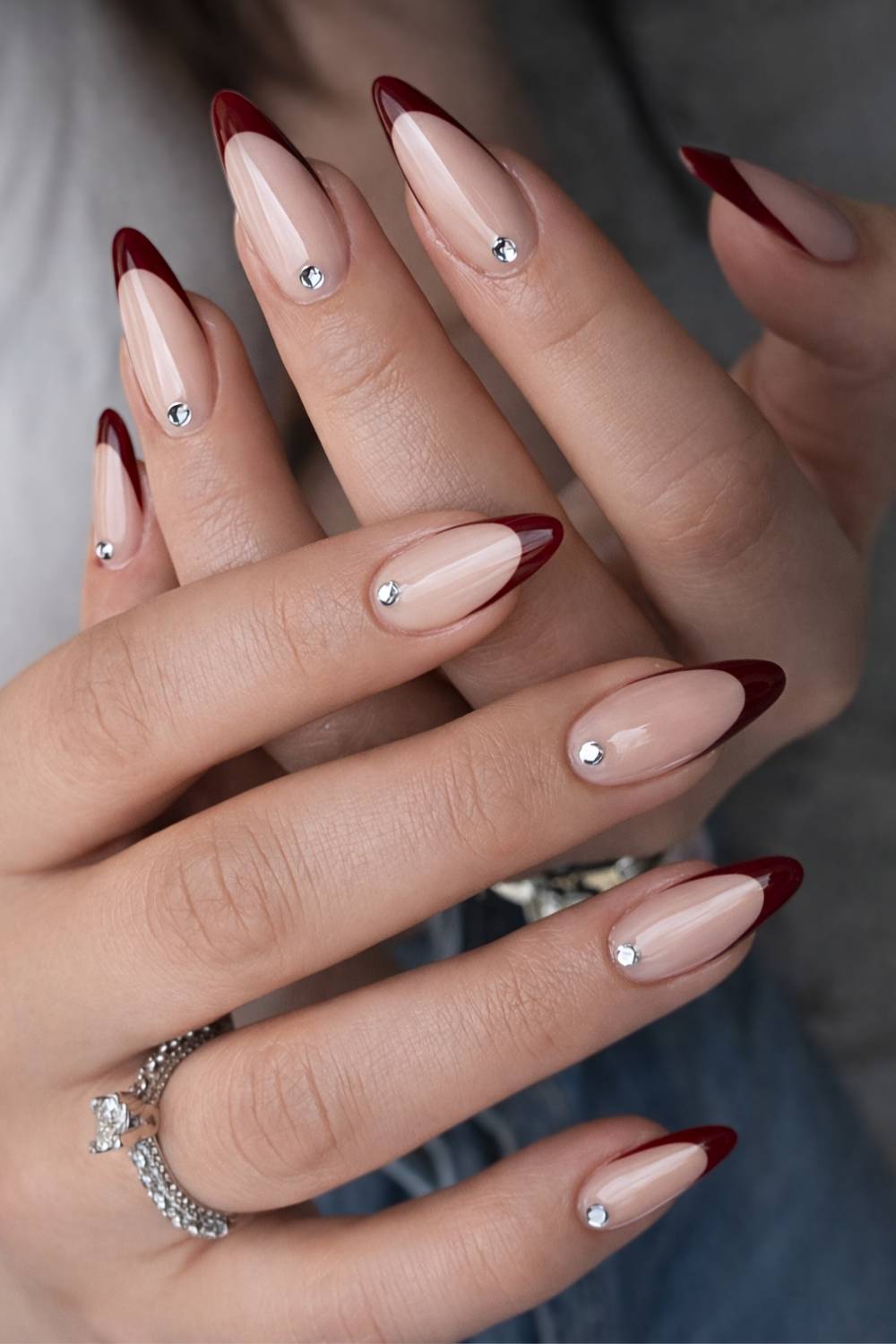 Burgundy French mani with cuticle rhinestones