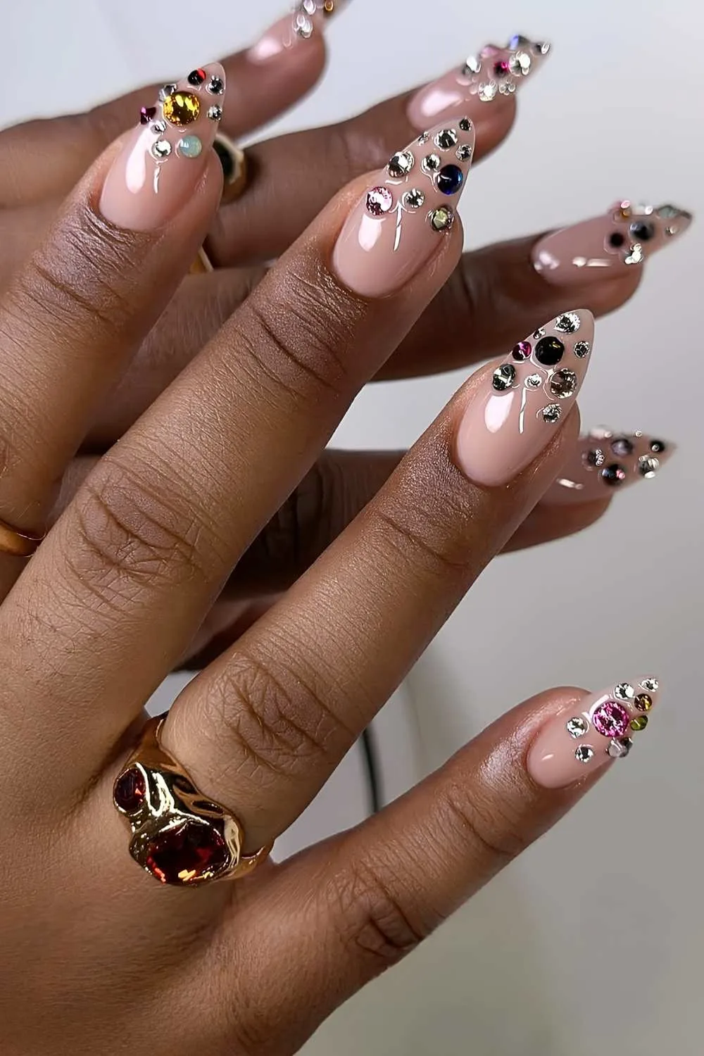 Neutral nails with bedazzled tips