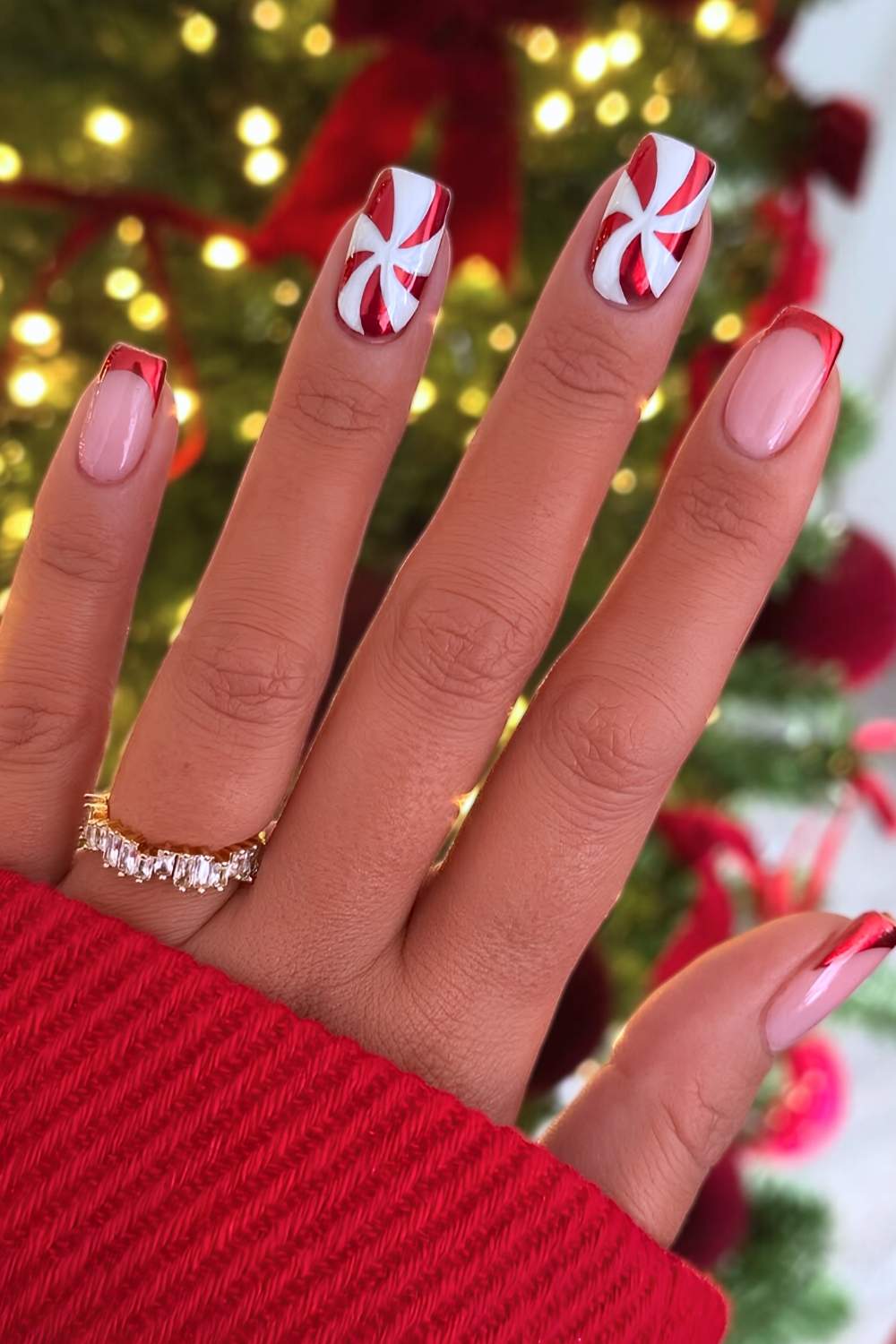 Red chrome nails with peppermint swirls