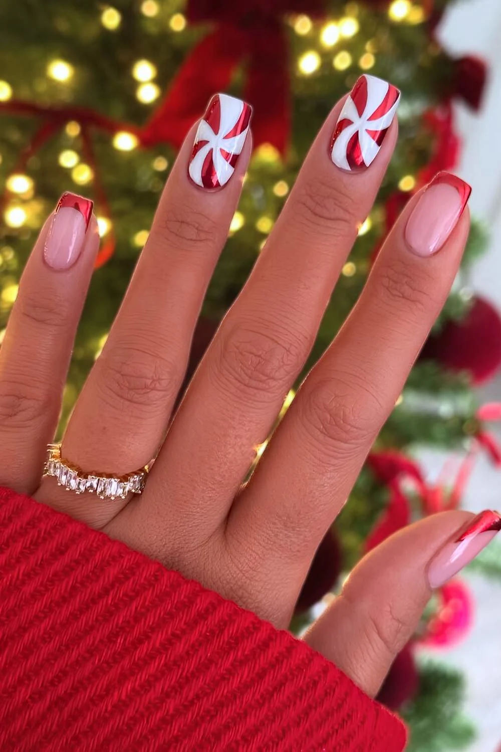 Red chrome nails with peppermint swirls