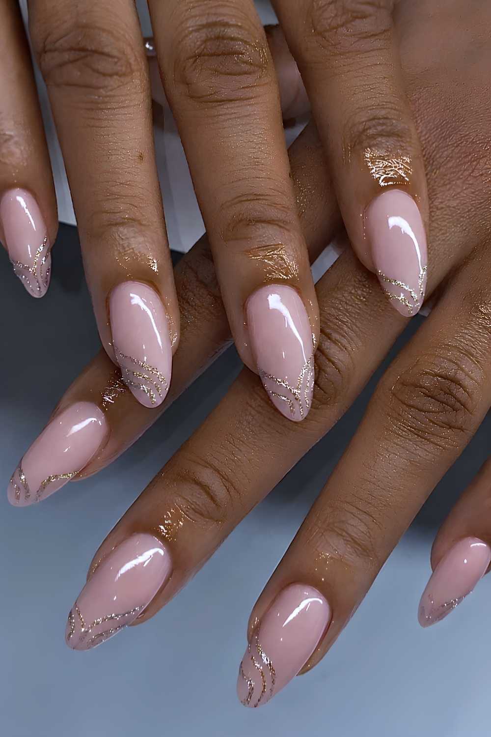 Swirly gold glitter French mani