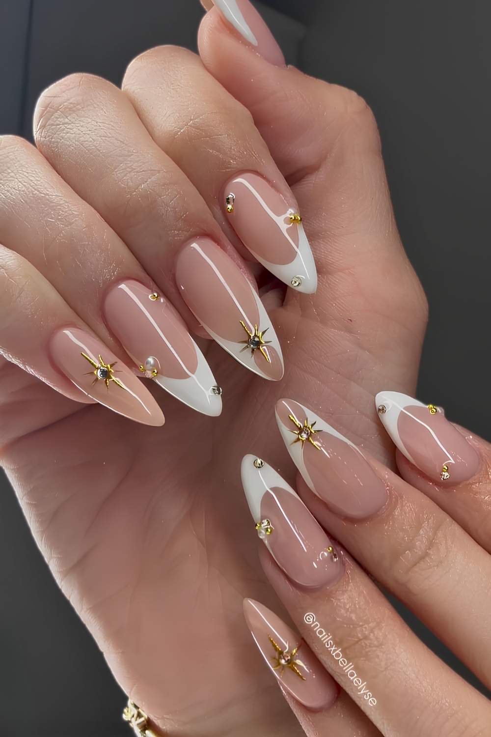 White French tip nails with gold celestial art