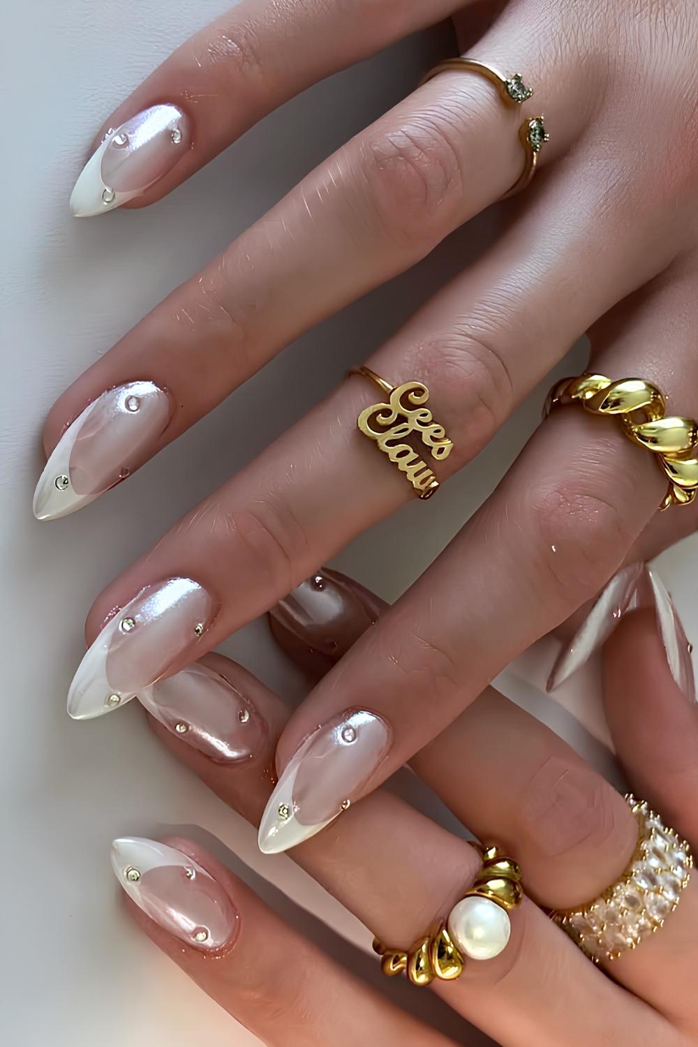 White chrome French mani with clear rhinestones