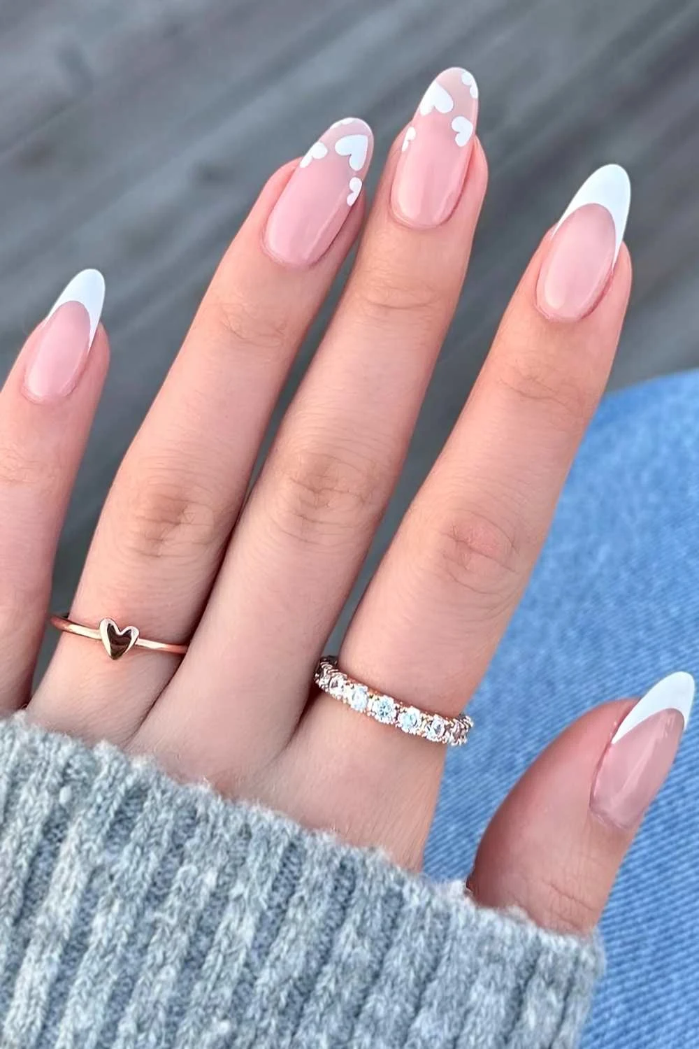 Almond white French tips with accent hearts