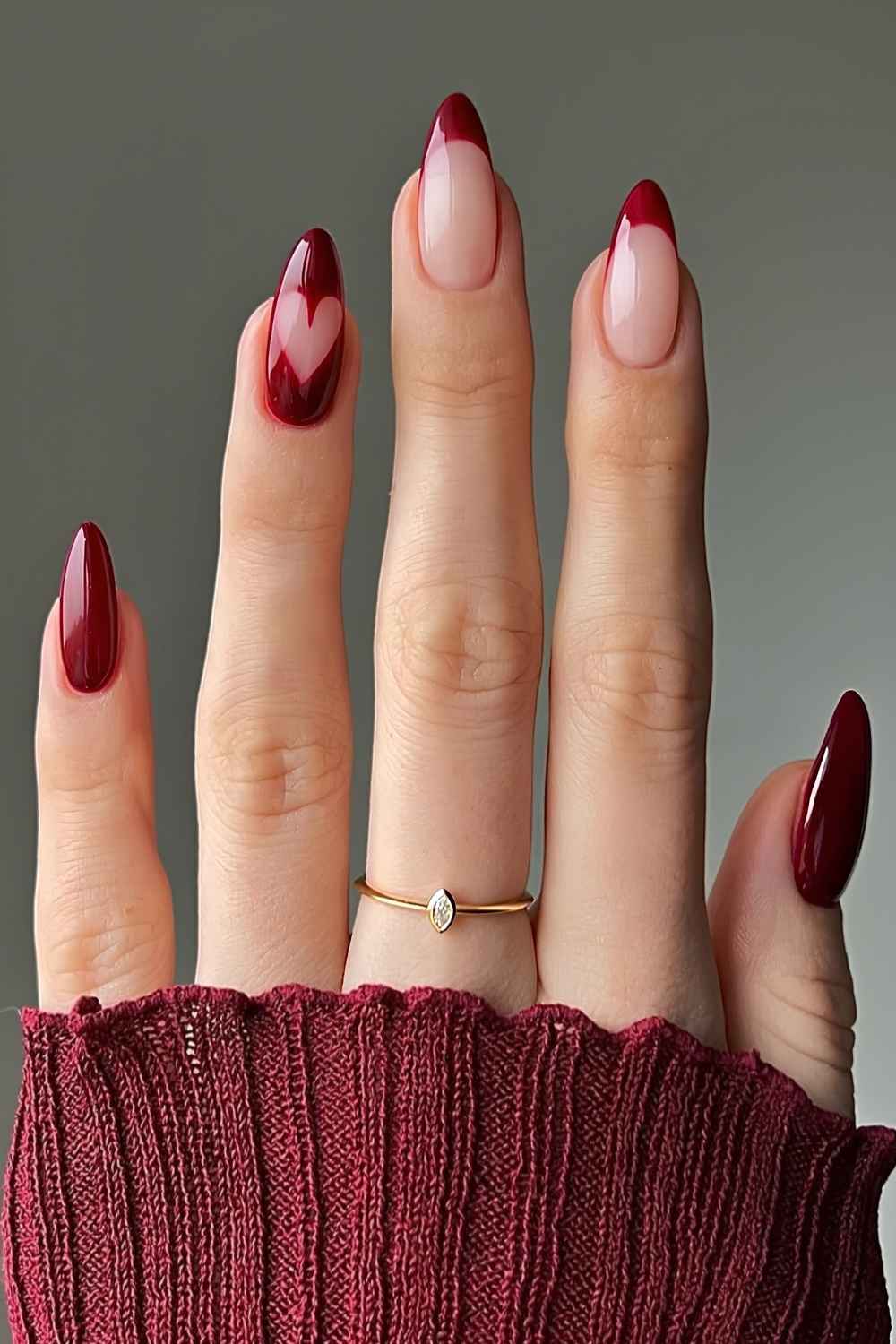 Burgundy nails with negative space heart art