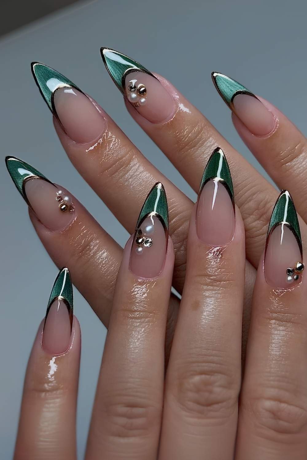 Green cat-eye French mani with pearls and gold accents