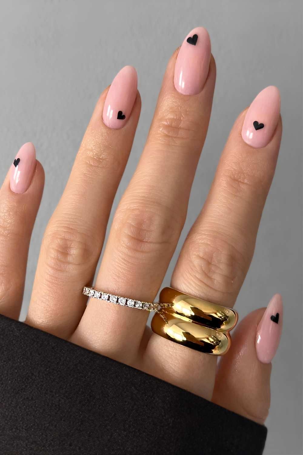 Neutral pink mani with black heart art