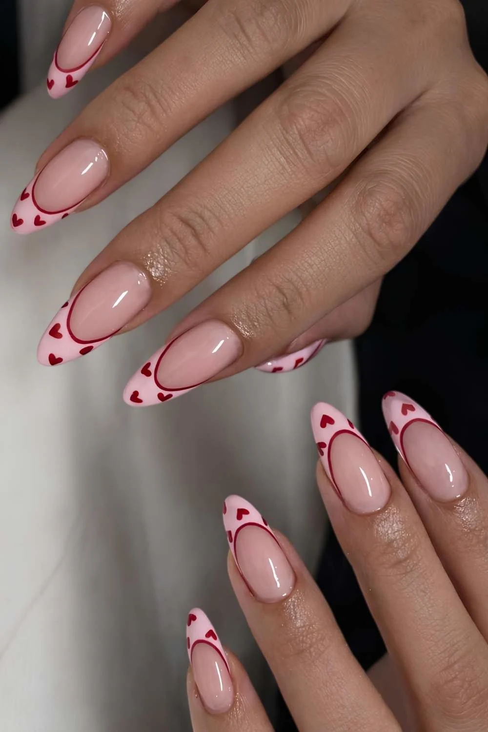 Pink and red French nails with hearts