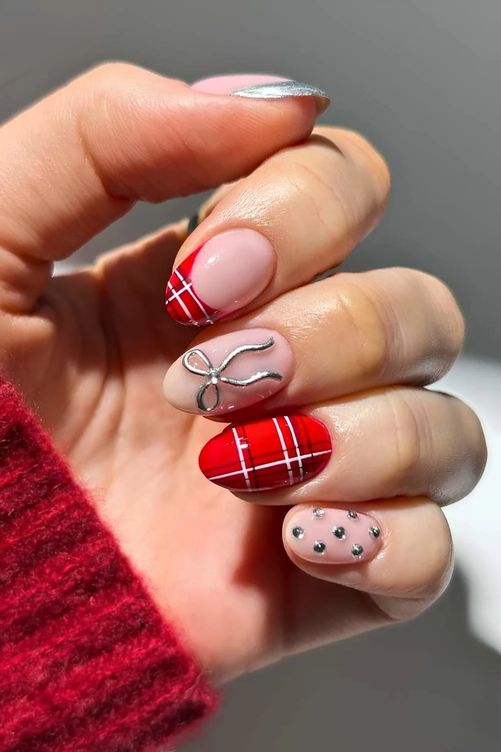 Red plaid nails with silver bows and gems