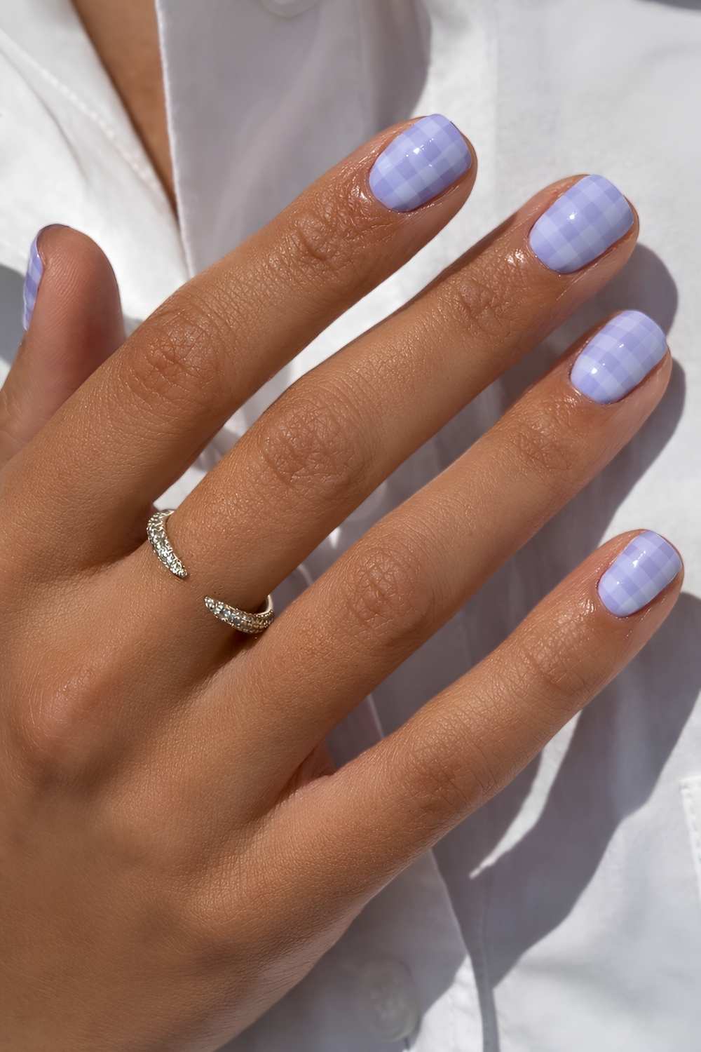 Short periwinkle nails with plaid pattern