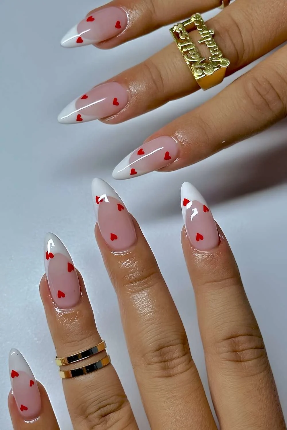 White French tips with micro red hearts