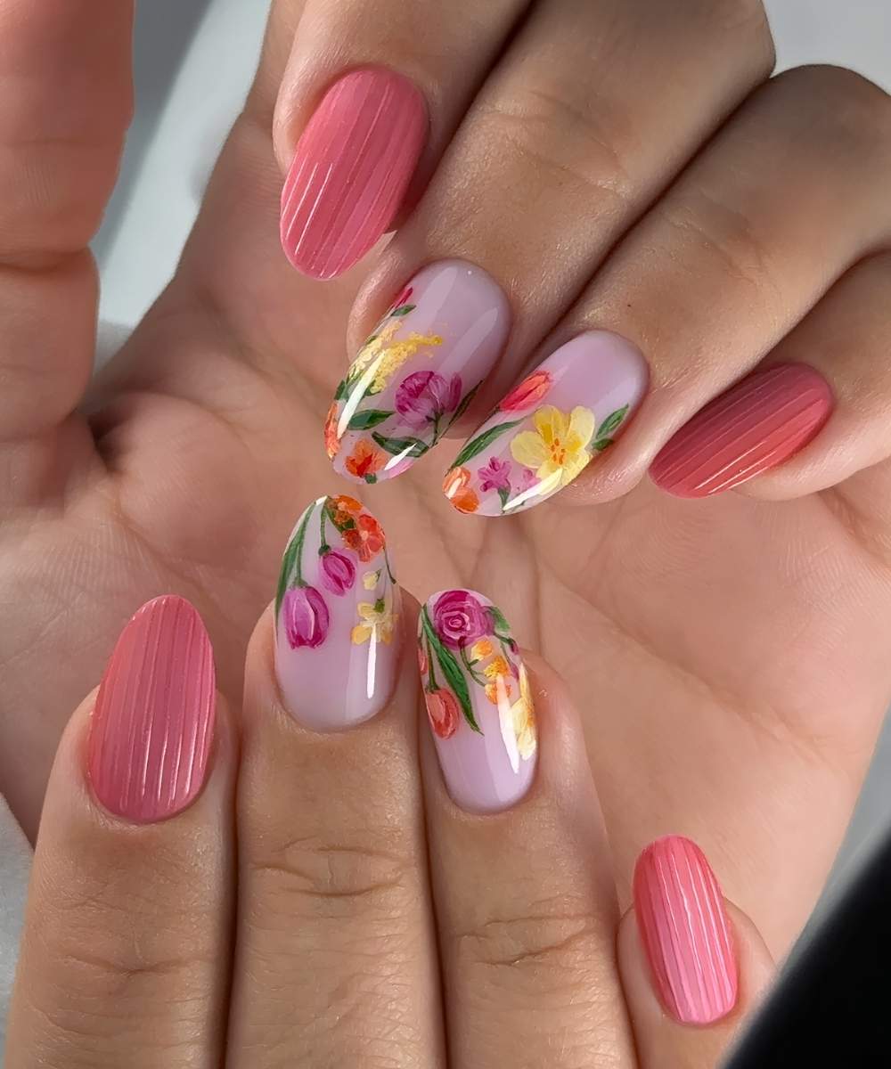 Bright pink ribbed glass mani with colorful flowers