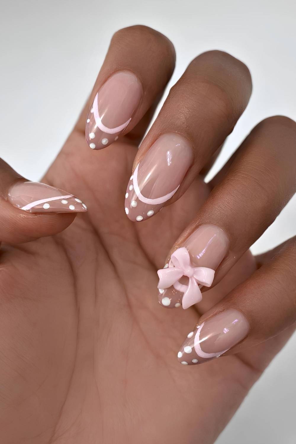 Brown French mani with bow and polka dots
