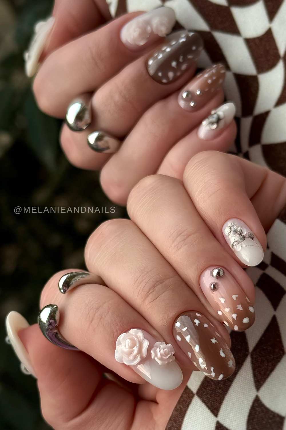 Brown and white bambi print nails with accent flowers