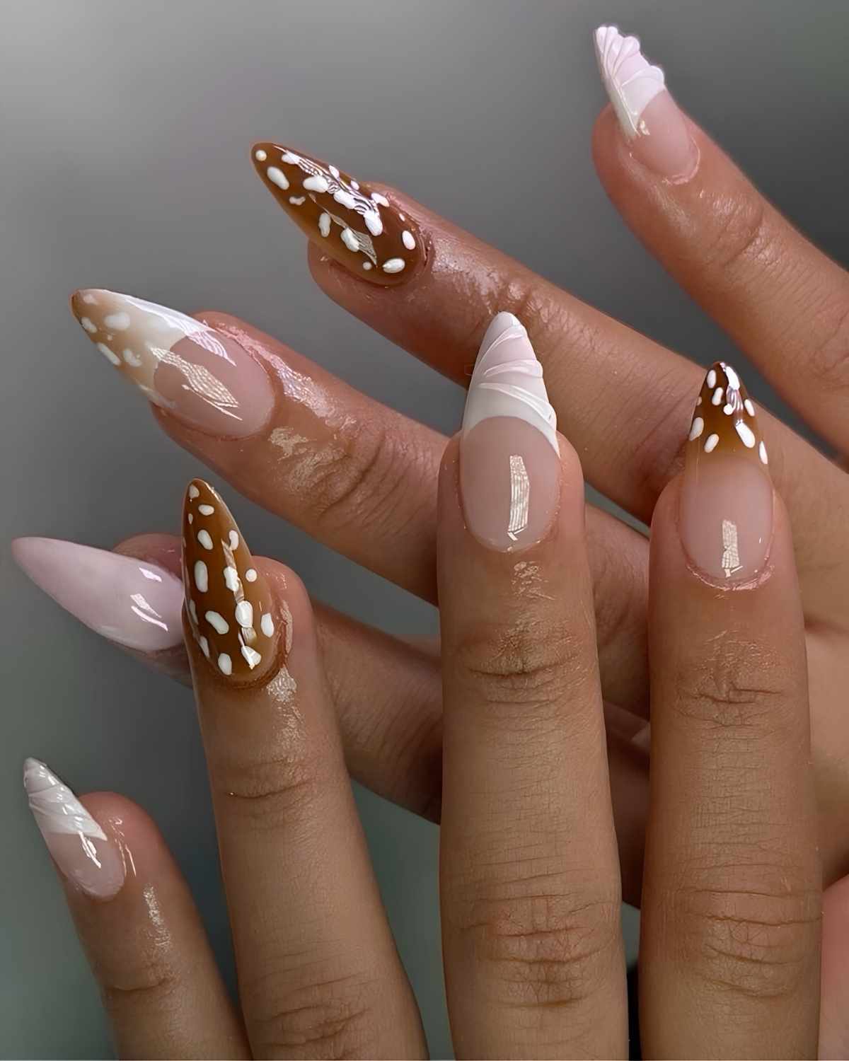 Brown nails with 3d swirls and doe print