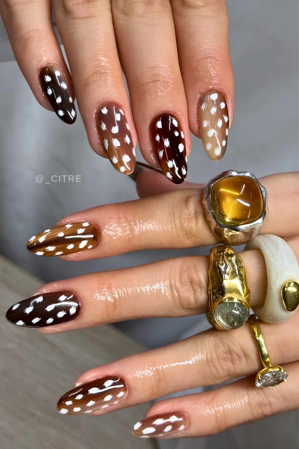 Deer print nails in different shades of brown